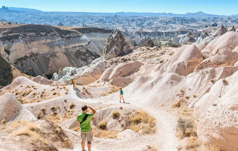 15 Fun Things to Do in Cappadocia, Turkey 10 A young outdoors man traveler watching the incredible deserted landscapes of the Goreme National Park in Cappadocia