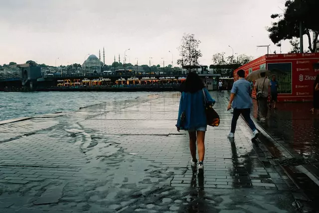 a picture of Istanbul with people  walking in the street