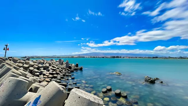 Best Areas to Stay in Maui for Couples (2025 Romantic Guide) 4 View of Haleakala from Kahului Harbor's west breakwater | Unsplash